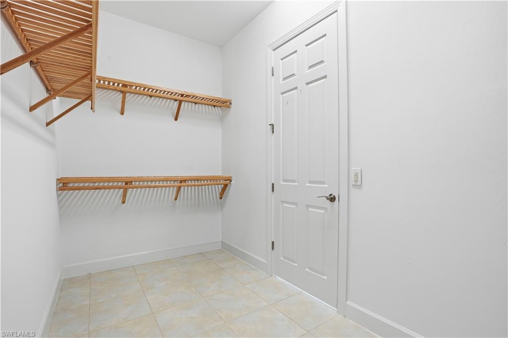 9328 Fieldstone Lane Naples, FL 34120 - Photo 19 of 40 a view of walk in closet