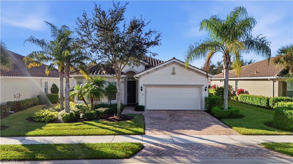 9328 Fieldstone Lane Naples, FL 34120 - Photo 2 of 40 a front view of house with yard and green space
