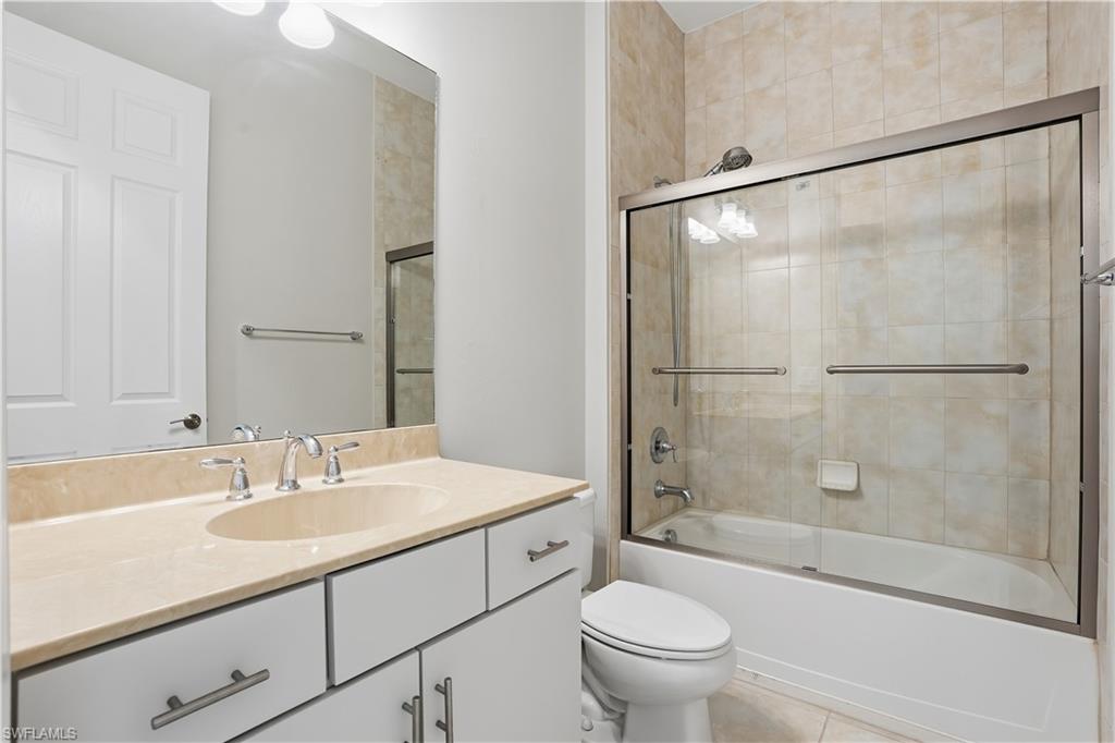 9328 Fieldstone Lane Naples, FL 34120 - Photo 22 of 40 a bathroom with a sink toilet and shower
