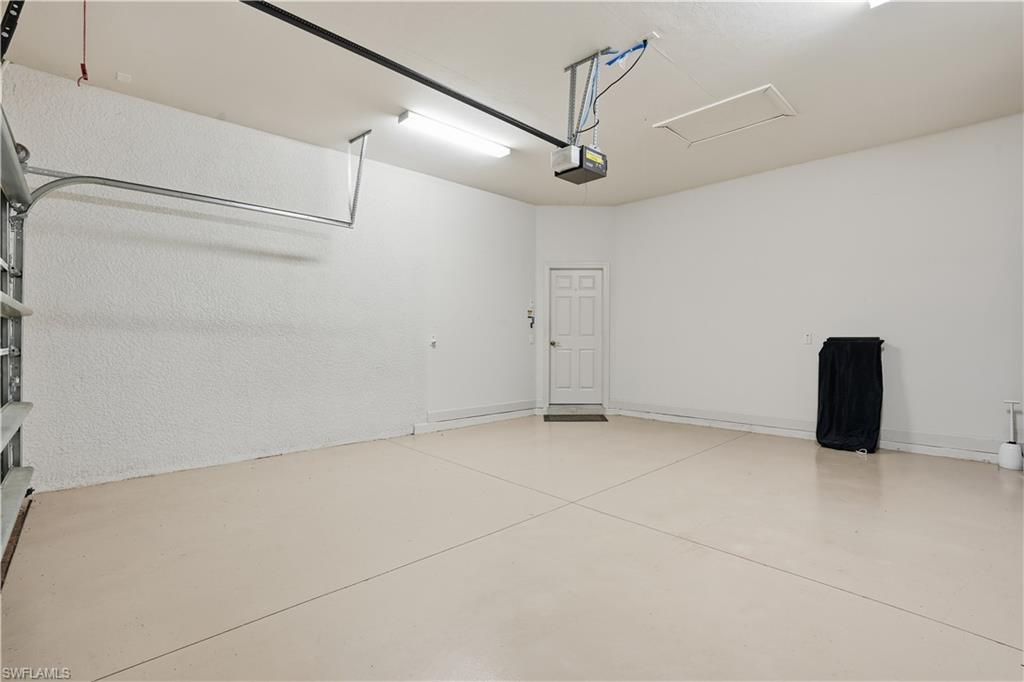9328 Fieldstone Lane Naples, FL 34120 - Photo 25 of 40 a view of an empty room with a window