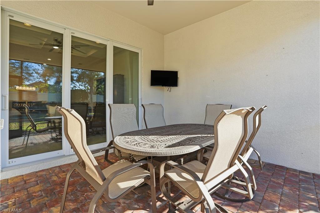 9328 Fieldstone Lane Naples, FL 34120 - Photo 26 of 40 a view of a dining room with furniture