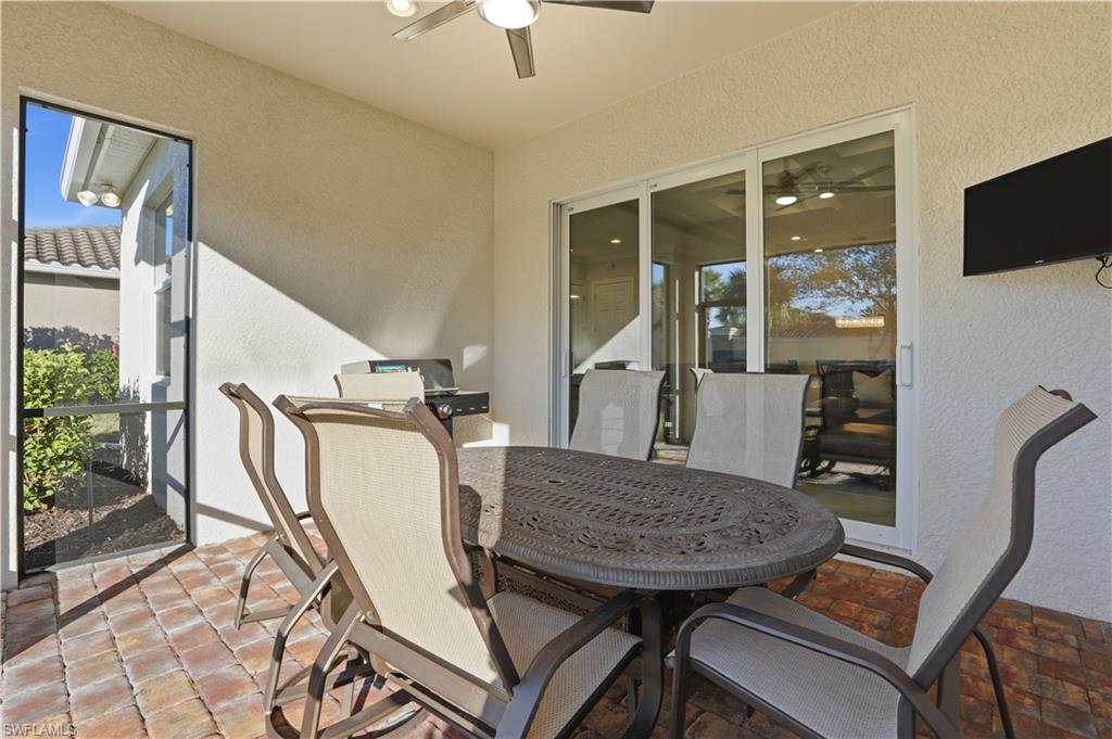9328 Fieldstone Lane Naples, FL 34120 - Photo 27 of 40 a view of a dining room with furniture