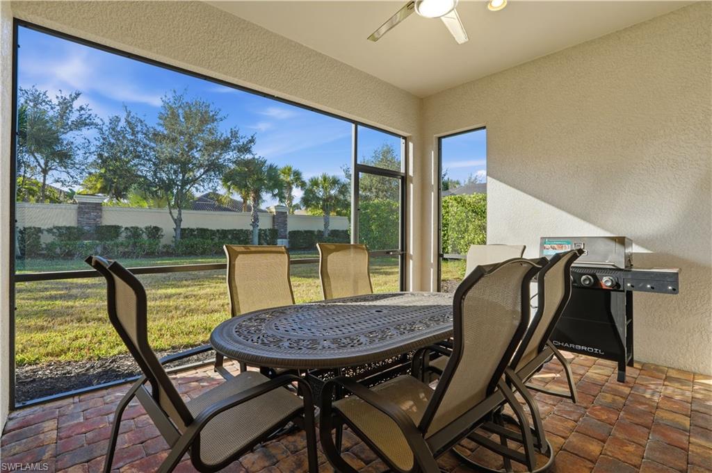 9328 Fieldstone Lane Naples, FL 34120 - Photo 28 of 40 a view of a chairs and table in patio