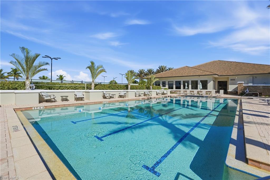 9328 Fieldstone Lane Naples, FL 34120 - Photo 31 of 40 a view of swimming pool with outdoor seating and deck