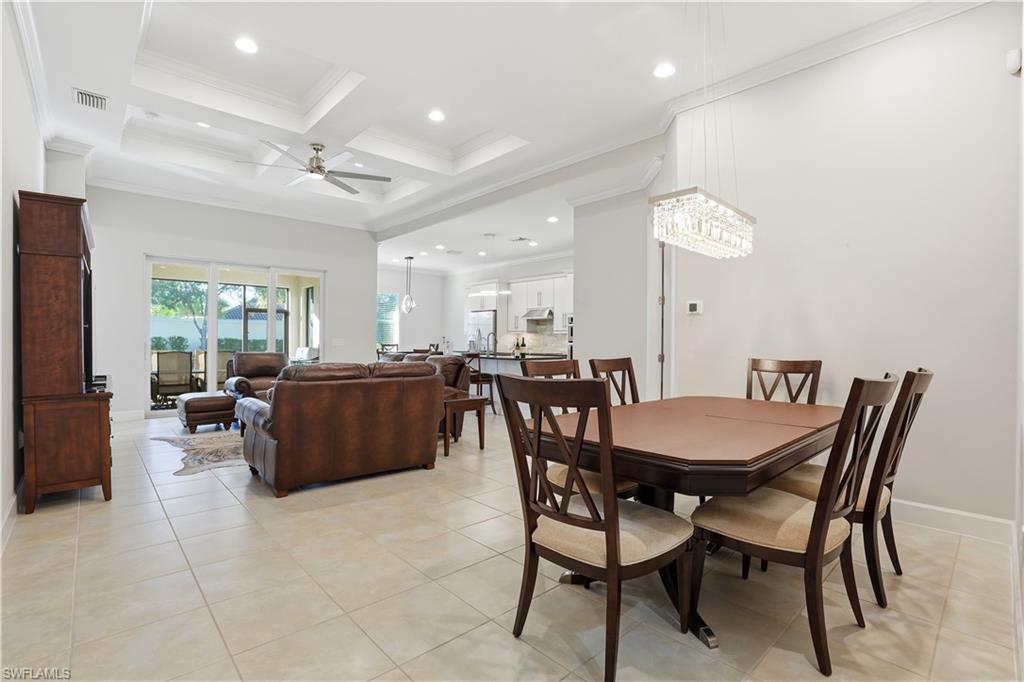 9328 Fieldstone Lane Naples, FL 34120 - Photo 8 of 40 a view of a dining room and livingroom with furniture