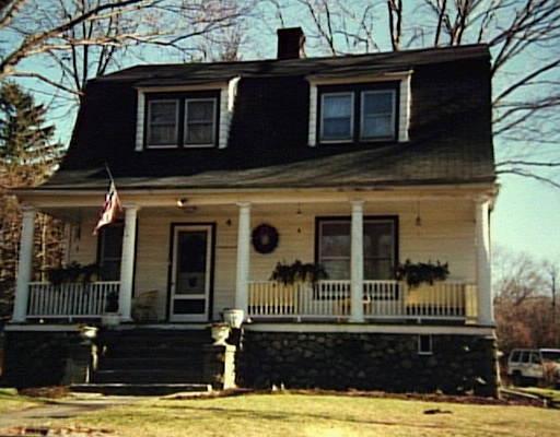 71 West Lane Ridgefield, CT 06877 - Photo 1 of 1 a view of a house with a large window and potted plants