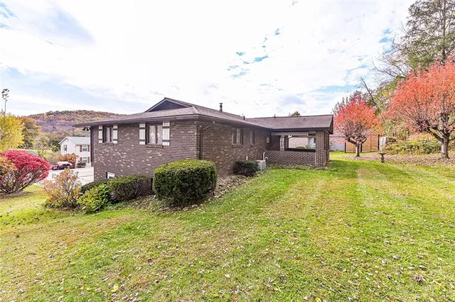a backyard of a house with lots of green space