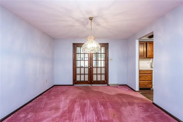 a view of empty room with windows