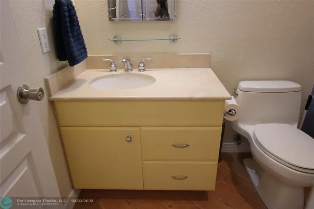 a bathroom with a sink and a toilet
