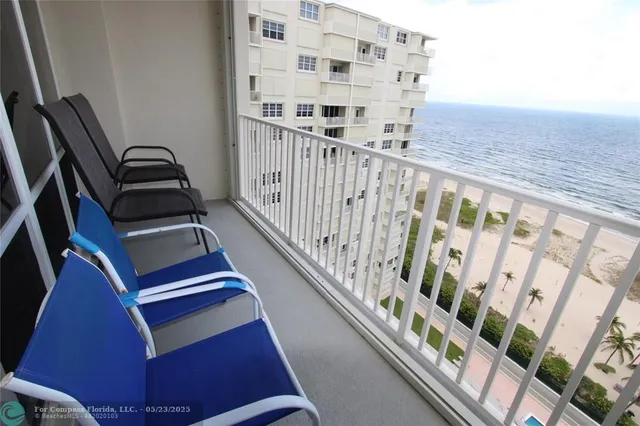 a view of staircase with wooden floor and white walls
