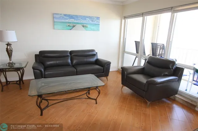 a living room with furniture and a window