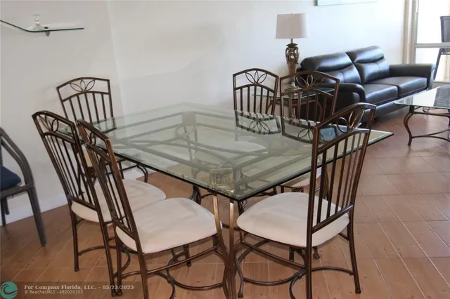a view of a dining room and hall with furniture