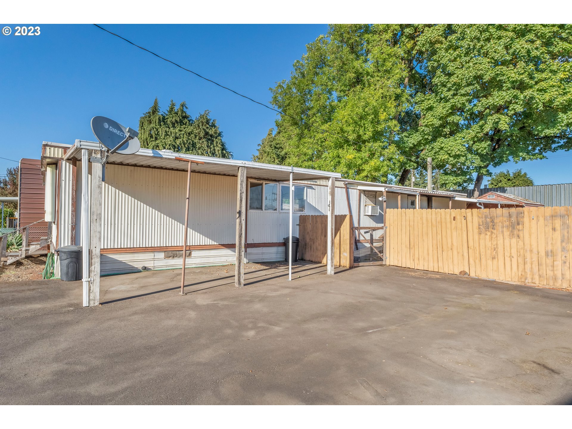 1117 34th Street Springfield, OR 97478 - Photo 6 of 39 a view of a backyard with hardwood area and lake view