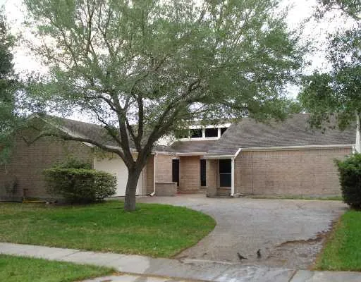 front view of a house with a garden