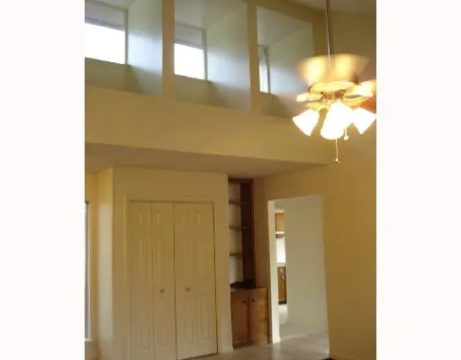 a bathroom with a granite countertop sink and a large mirror