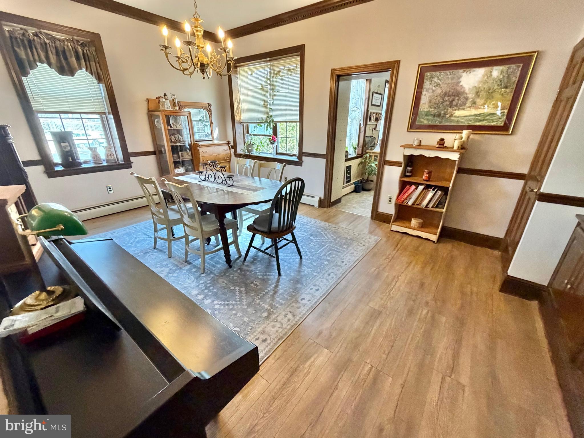 126 4th Avenue Roebling, NJ 08554 - Photo 20 of 43 a view of a dining room with furniture a chandelier and wooden floor