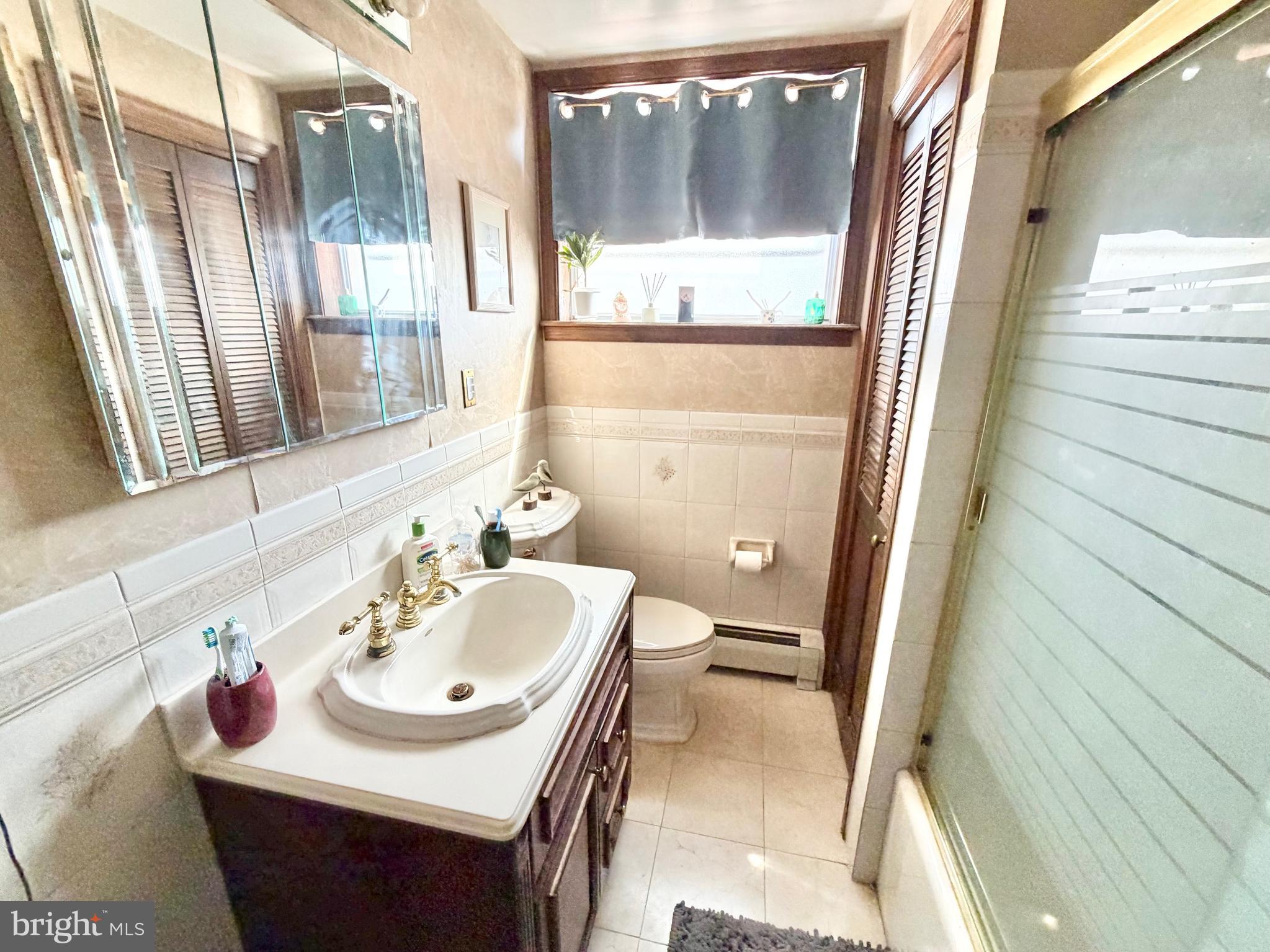 126 4th Avenue Roebling, NJ 08554 - Photo 22 of 43 a bathroom with a sink and a mirror