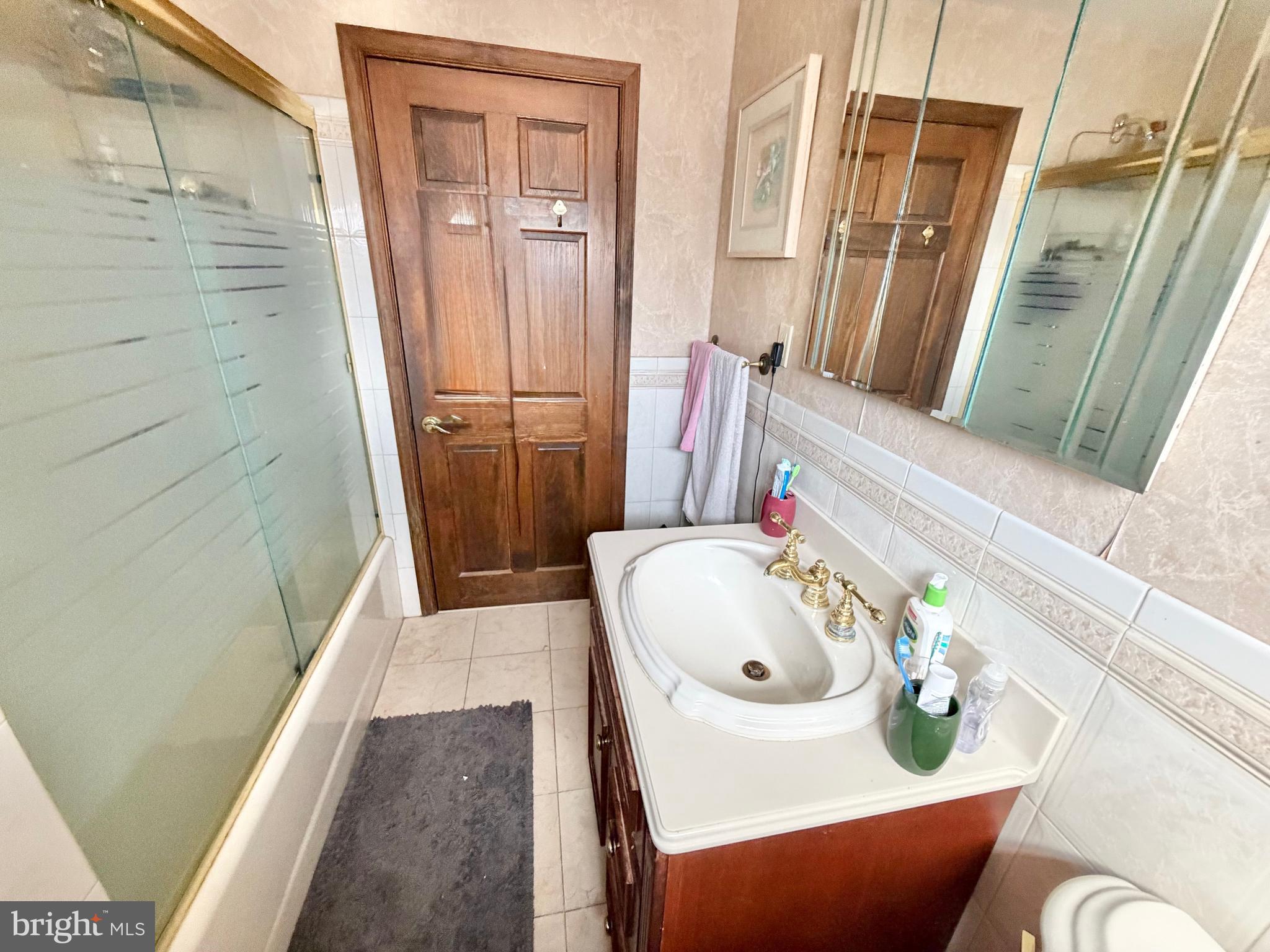 126 4th Avenue Roebling, NJ 08554 - Photo 23 of 43 a bath room with a sink and a mirror