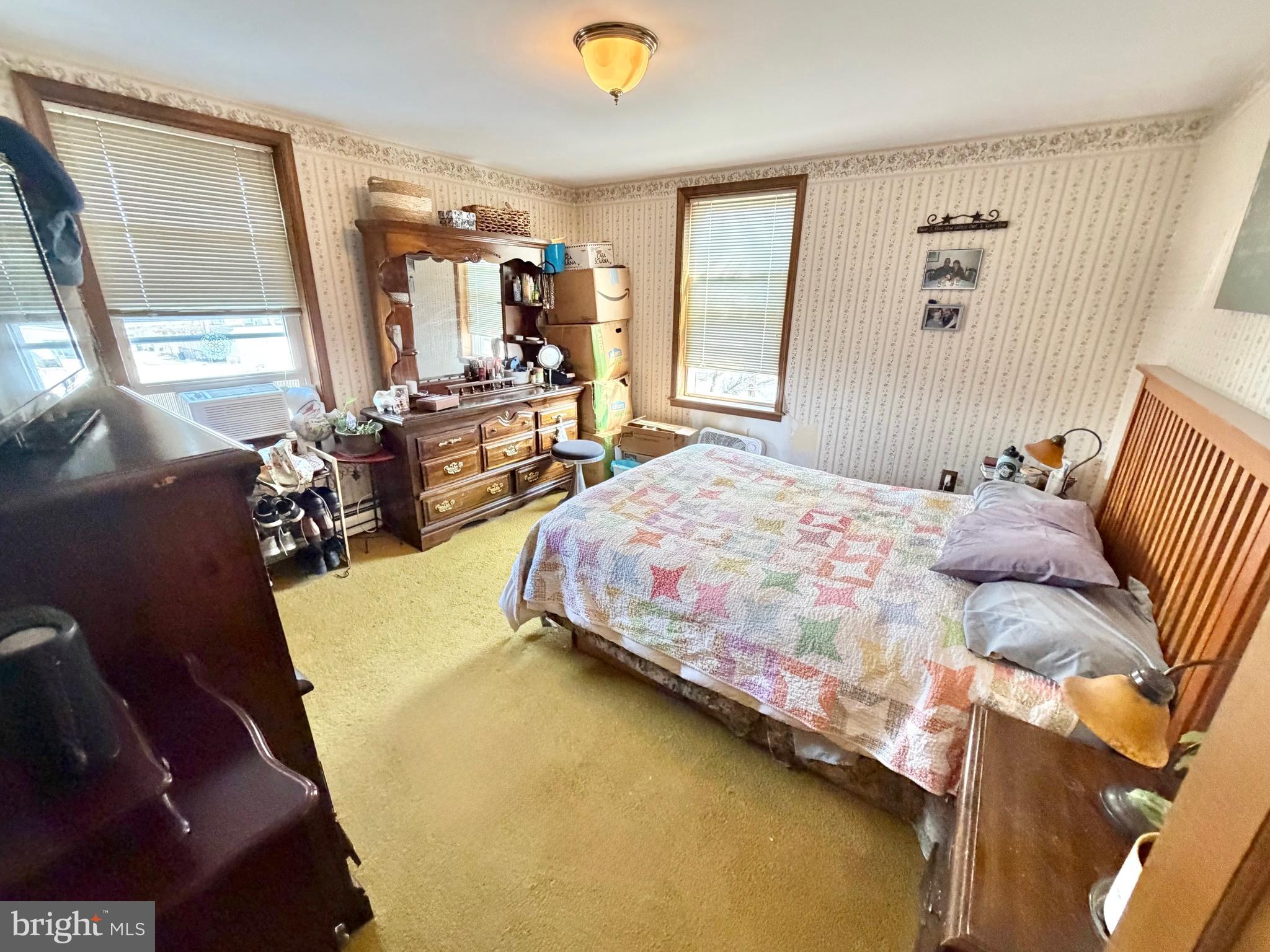 126 4th Avenue Roebling, NJ 08554 - Photo 24 of 43 a bedroom with a bed and wooden floor