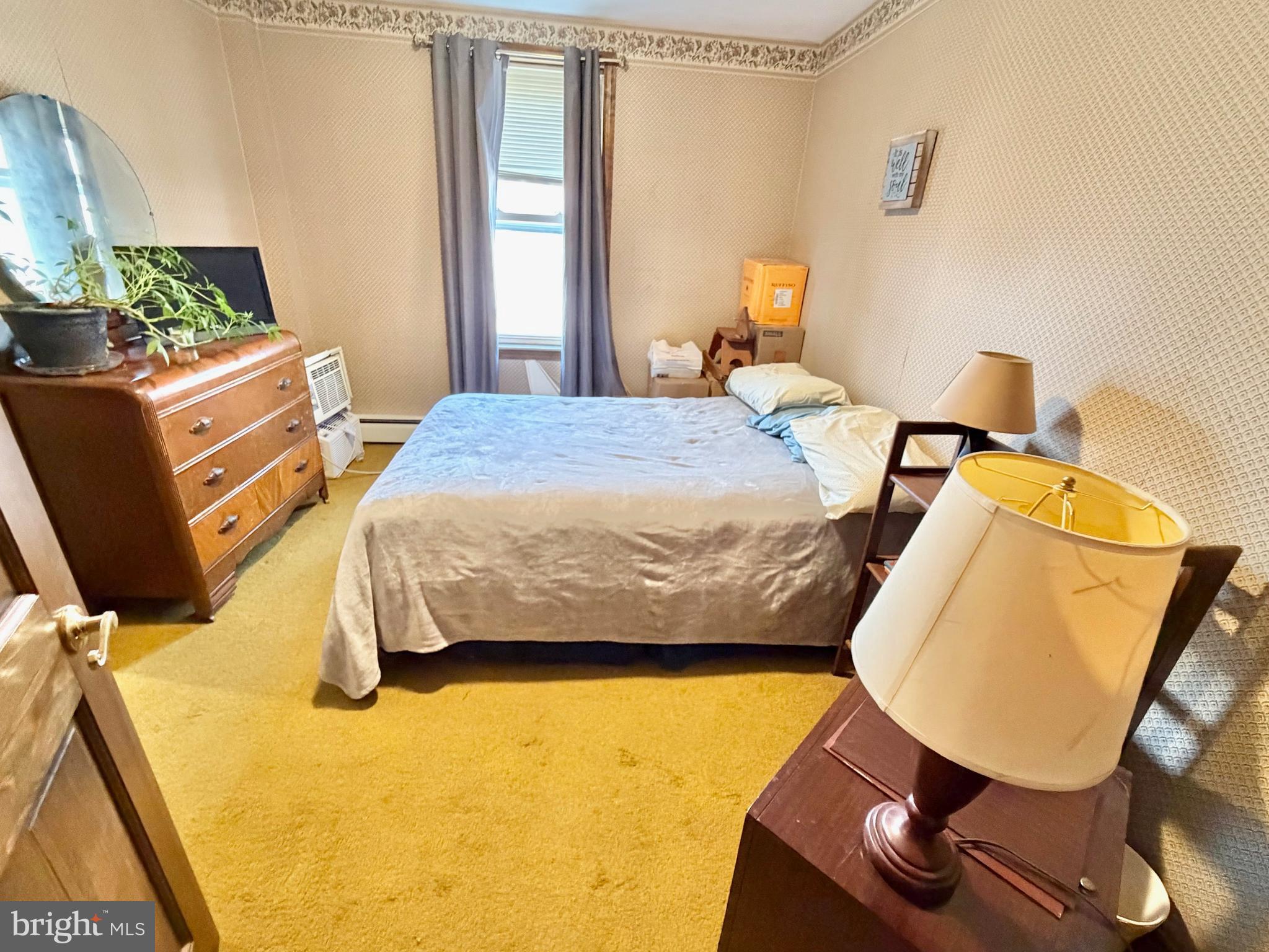126 4th Avenue Roebling, NJ 08554 - Photo 28 of 43 a bedroom with a bed and wooden floor
