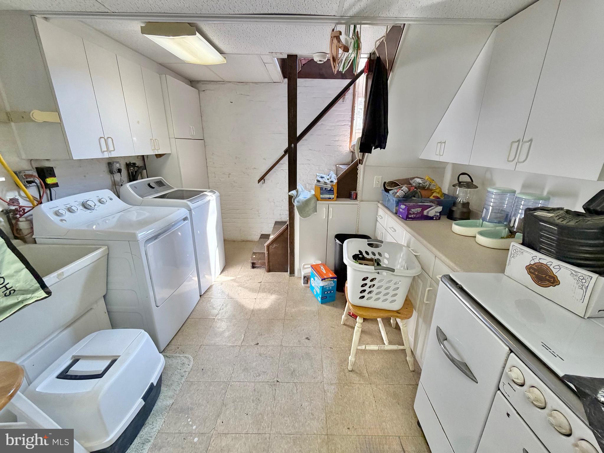 126 4th Avenue Roebling, NJ 08554 - Photo 36 of 43 a view of a kitchen with fridge and workspace