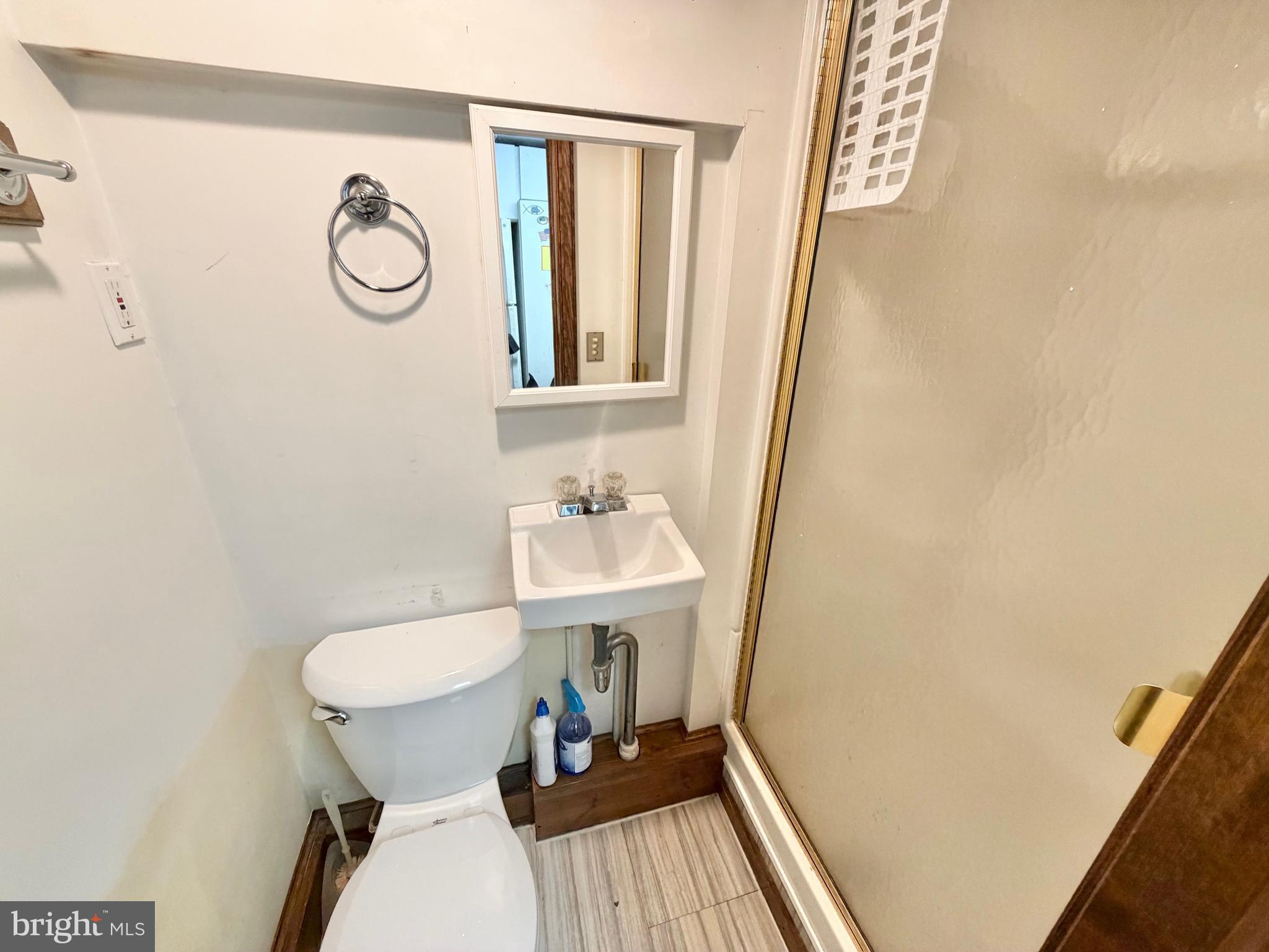 126 4th Avenue Roebling, NJ 08554 - Photo 37 of 43 a bathroom with a sink a toilet a mirror and vanity