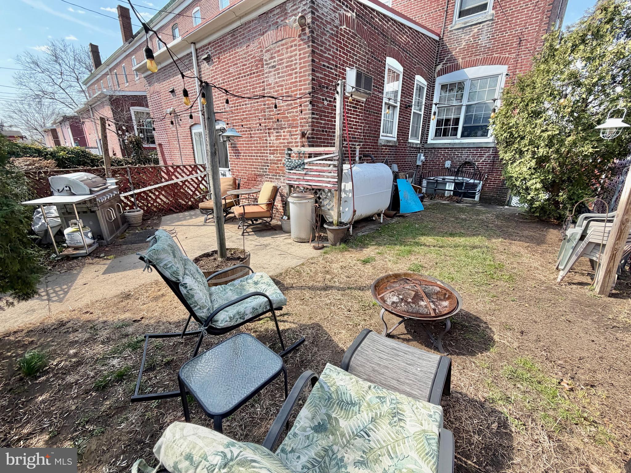 126 4th Avenue Roebling, NJ 08554 - Photo 38 of 43 a view of a backyard with furniture and a fire pit