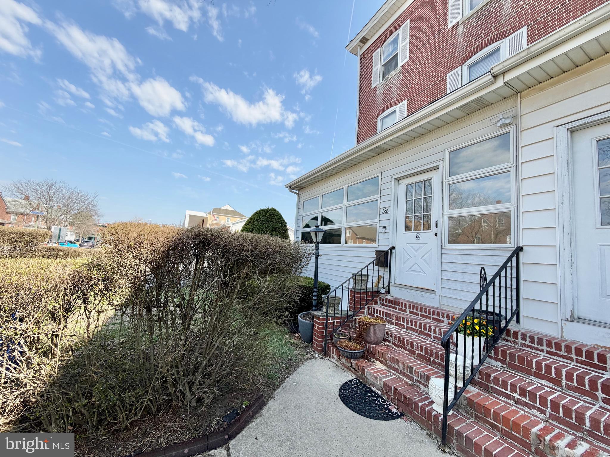 126 4th Avenue Roebling, NJ 08554 - Photo 40 of 43 a front view of a house with garden and sitting area