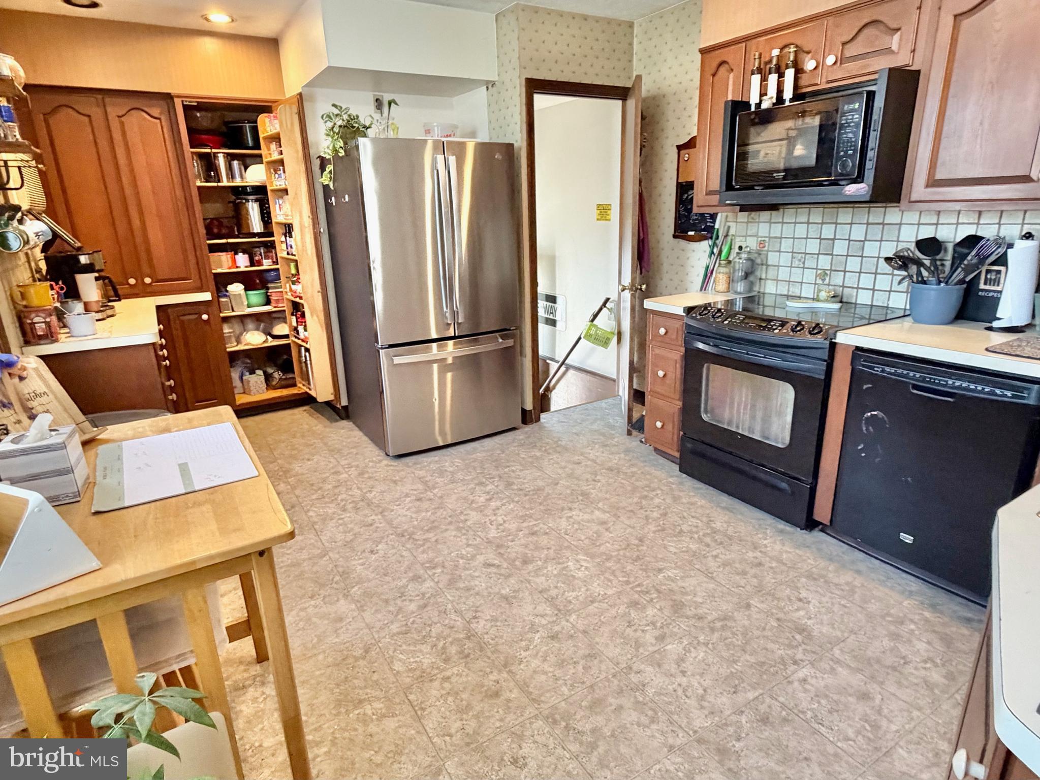 126 4th Avenue Roebling, NJ 08554 - Photo 5 of 43 a kitchen with stainless steel appliances a refrigerator and a stove top oven