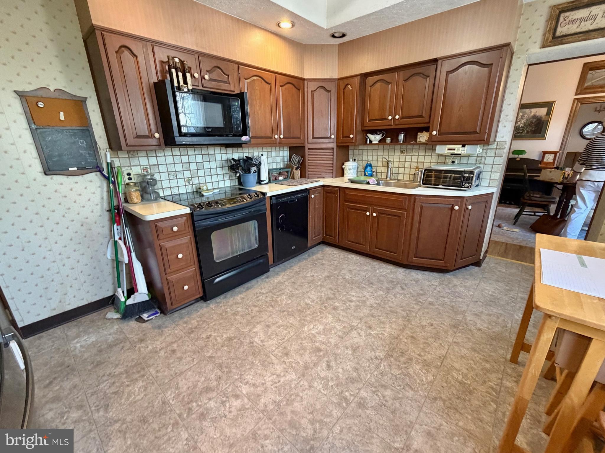126 4th Avenue Roebling, NJ 08554 - Photo 7 of 43 a kitchen with a refrigerator and a sink