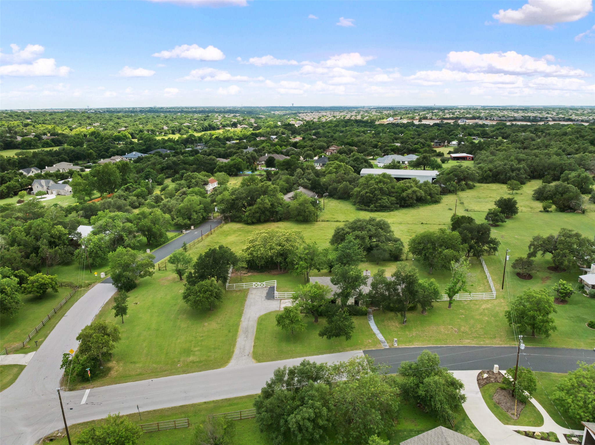 1600 Pin Oak Lane Round Rock, TX 78681 - Photo 37 of 40 Expansive property featuring a verdant landscape with mature trees and open green spaces
