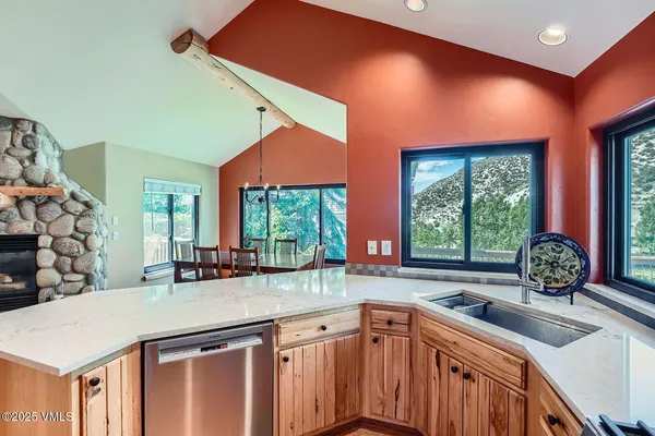 a kitchen with a sink and a large window