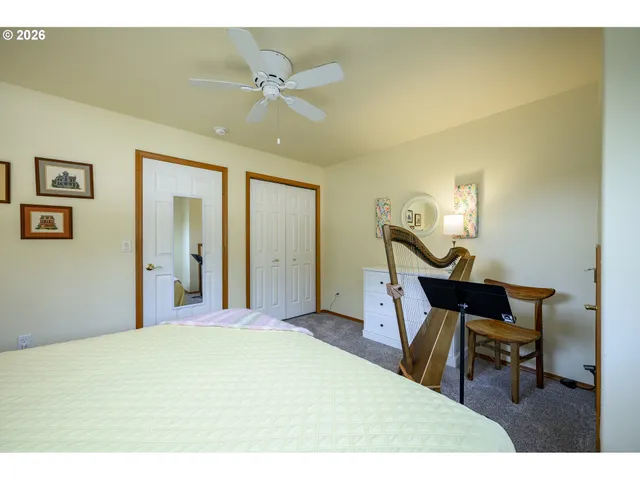 a bedroom with a bed and a mirror