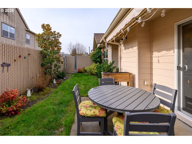 a wooden talbe sitting in front of a house