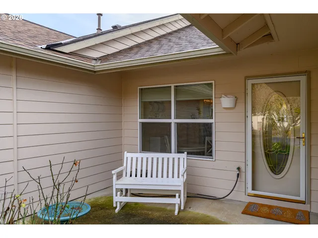 a view of a door and chair in a patio