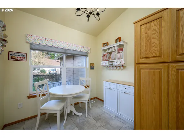 a dining room with furniture and window