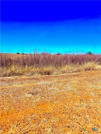 a view of a yard with an ocean