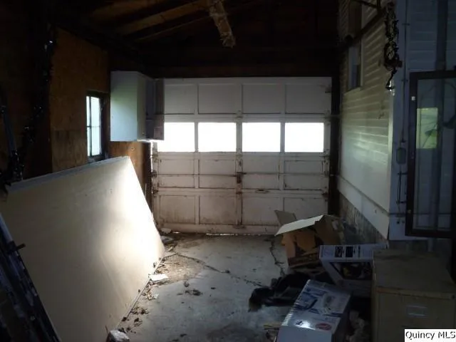 a room with a mirror and a flat screen tv