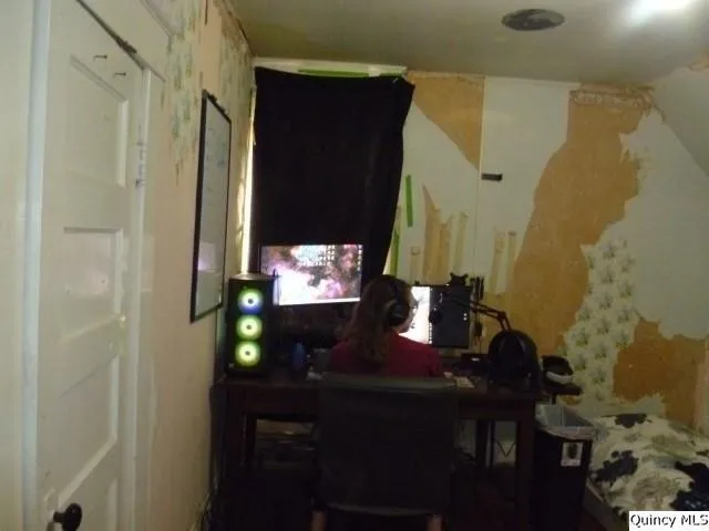 a room with a sink and a mirror