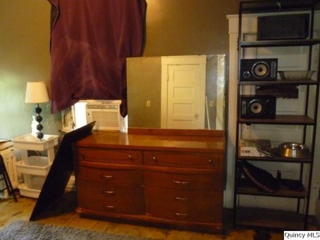 233 North 1st Street Carthage, IL 62321 - Photo 23 of 30 a room with a sink and a mirror