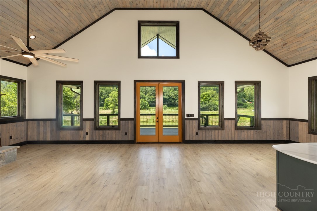790 Howard Edmisten Road Sugar Grove, NC 28679 - Photo 9 of 45 a view of an empty room with wooden floor and a window