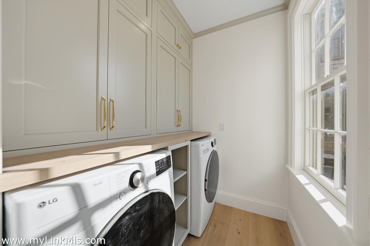 85 Orange Street Nantucket, MA 02554 - Photo 24 of 89 a utility room with dryer and washer