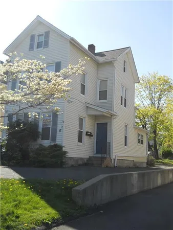 a front view of a house with yard
