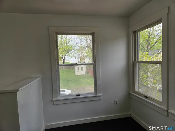 a view of an empty room with a window