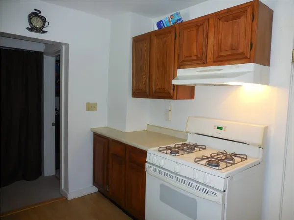a kitchen with a stove and a refrigerator