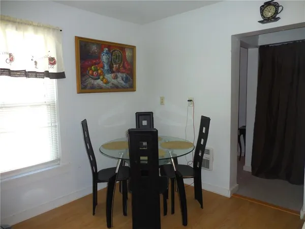a view of a dining room with furniture and window
