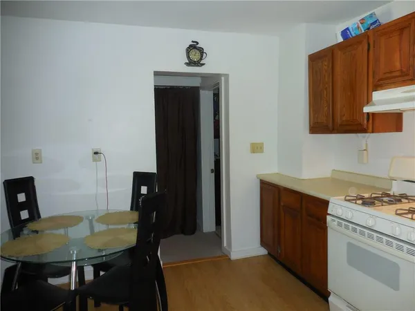 a kitchen with a table chairs and a stove