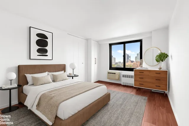 a bedroom with a bed and window