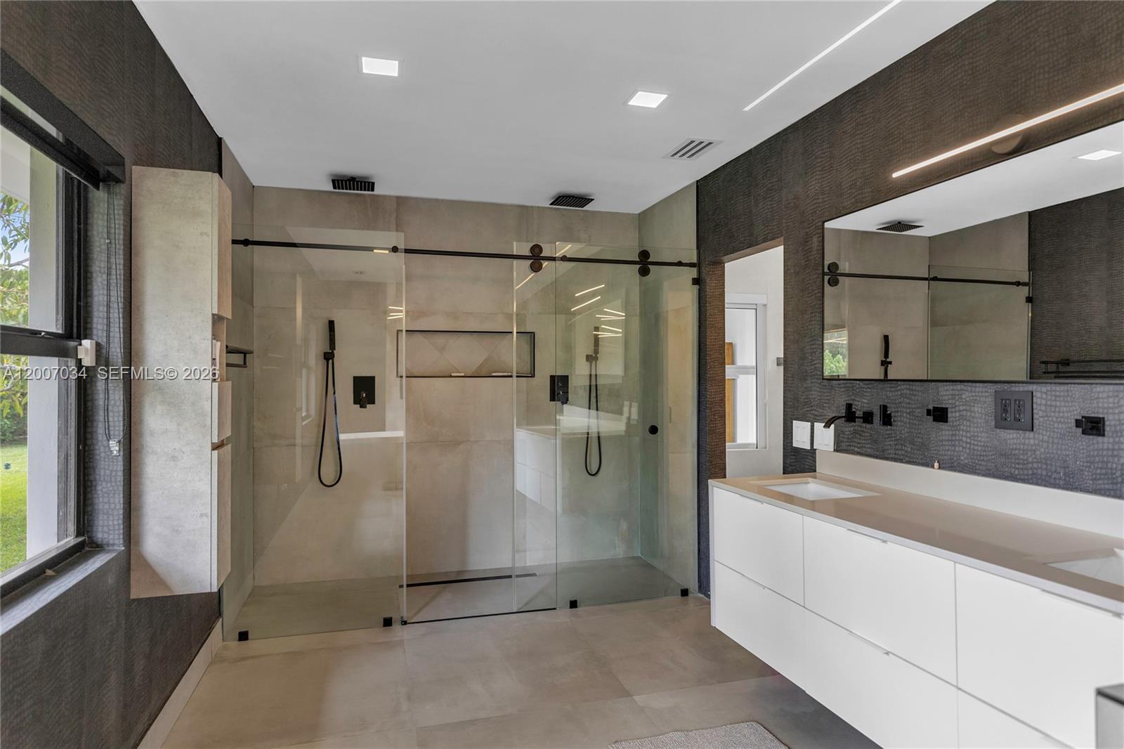 13540 Southwest 98th Court Miami, FL 33176 - Photo 11 of 43 a bathroom with a sink a shower and mirror