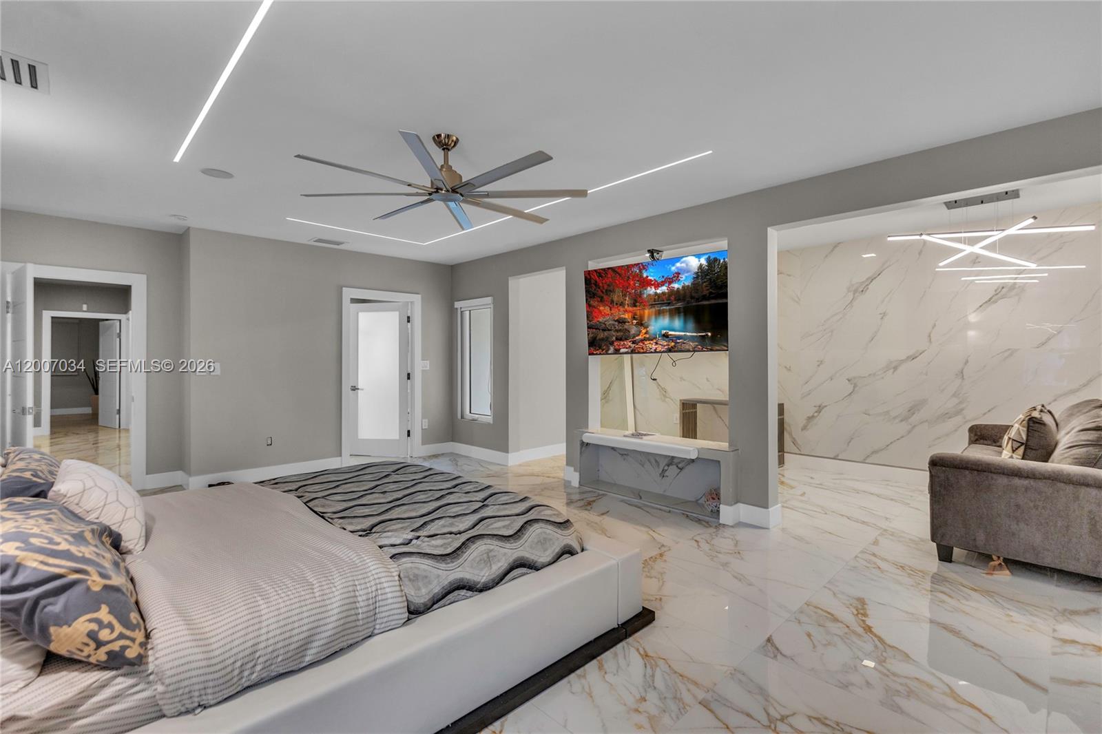 13540 Southwest 98th Court Miami, FL 33176 - Photo 16 of 43 a bedroom with a bed furniture and a flat screen tv